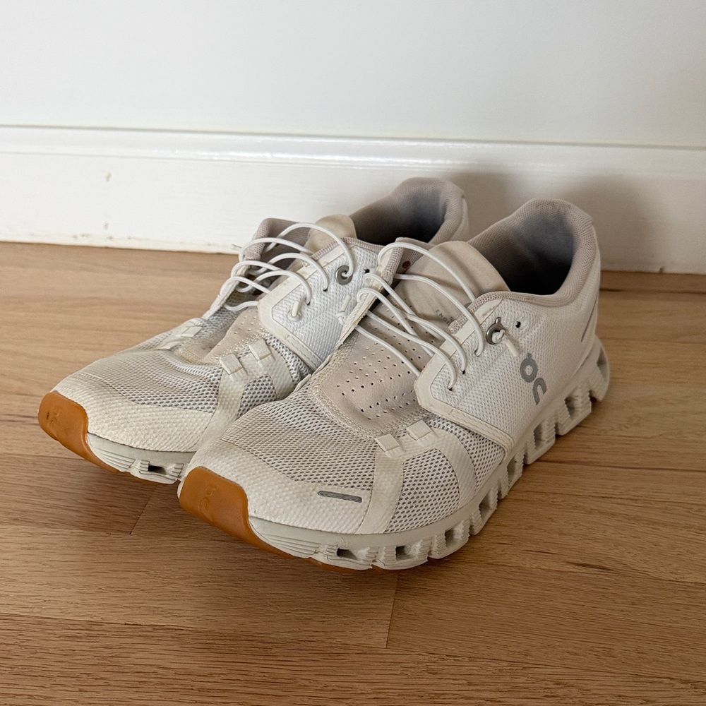 On Running White and Tan Athletic Shoes